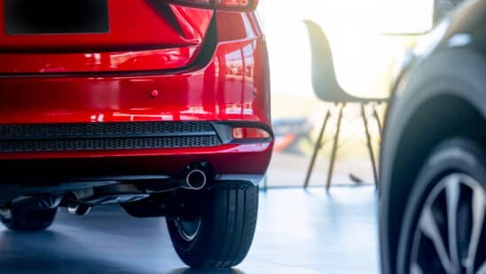 red car in dealership showroom