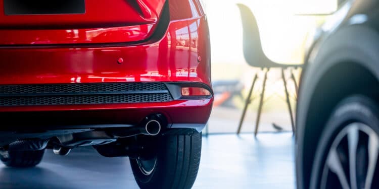 red car in dealership showroom