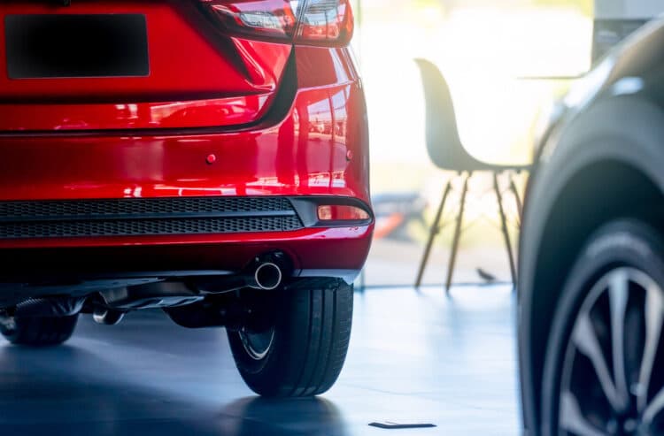 red car in dealership showroom