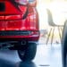 red car in dealership showroom