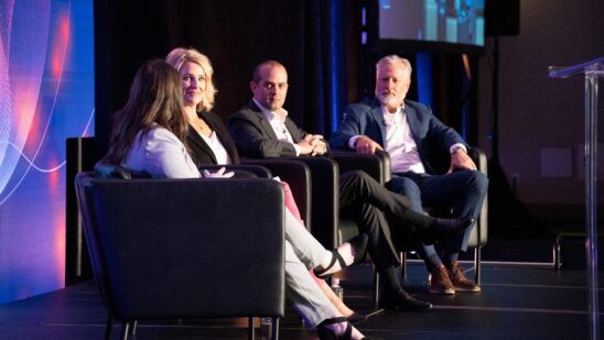 Panelists on the stage at Auto Finance Summit East