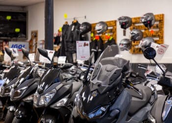 various models of motorcycles displayed in a dealership