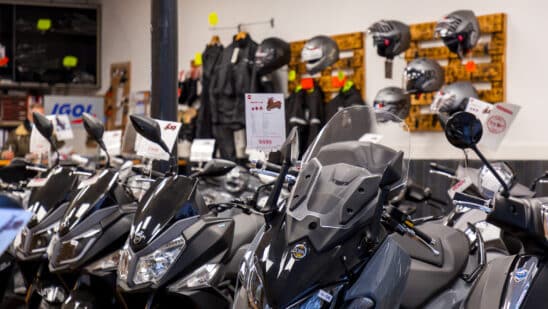 various models of motorcycles displayed in a dealership