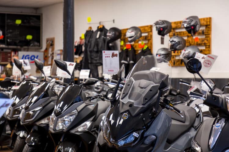 various models of motorcycles displayed in a dealership