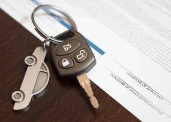 Car loan application with car keys. Capture rates drop amid credit degradation at Automotive Credit