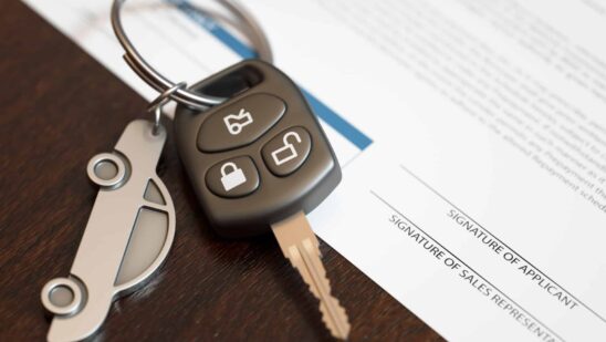 Car loan application with car keys. Capture rates drop amid credit degradation at Automotive Credit