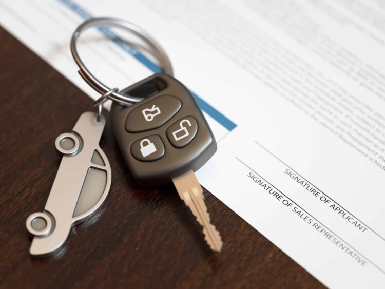 Car loan application with car keys. Capture rates drop amid credit degradation at Automotive Credit