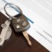 Car loan application with car keys. Capture rates drop amid credit degradation at Automotive Credit