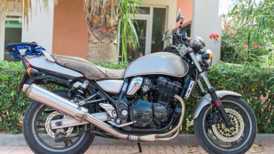Modern motorcycle parked on the street. RumbleOn Finance sputters in Q1.