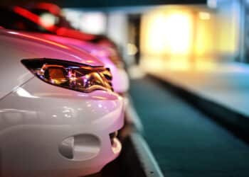 Side profile of the front of a car parked at night