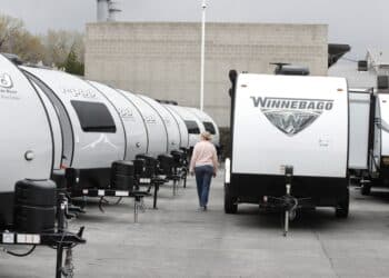 A Winnebago Industries Inc. travel trailer stands at Motor Sportsland RV dealership in Salt Lake City, Utah, U.S., on Monday, April 6, 2020. Amid the coronvirus, government agencies are obtaining RVs to house the homeless and provide housing for medical workers who can not return home in fear of spreading the virus.