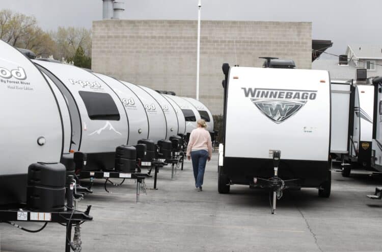 A Winnebago Industries Inc. travel trailer stands at Motor Sportsland RV dealership in Salt Lake City, Utah, U.S., on Monday, April 6, 2020. Amid the coronvirus, government agencies are obtaining RVs to house the homeless and provide housing for medical workers who can not return home in fear of spreading the virus.