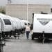 A Winnebago Industries Inc. travel trailer stands at Motor Sportsland RV dealership in Salt Lake City, Utah, U.S., on Monday, April 6, 2020. Amid the coronvirus, government agencies are obtaining RVs to house the homeless and provide housing for medical workers who can not return home in fear of spreading the virus.