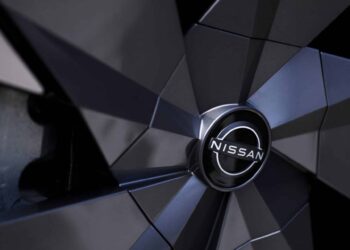 A Nissan Motor Co. badge on the wheel hub of an Ariya electric crossover sport utility vehicle (SUV) during a test driving event in Tokyo, Japan, on Monday, April 17, 2023. Renault SA is set to cut its holding in Nissan to 15% from 43%, while Nissan intends to take a stake of as much as 15% in Renaults EV business, Ampere.