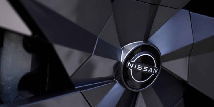 A Nissan Motor Co. badge on the wheel hub of an Ariya electric crossover sport utility vehicle (SUV) during a test driving event in Tokyo, Japan, on Monday, April 17, 2023. Renault SA is set to cut its holding in Nissan to 15% from 43%, while Nissan intends to take a stake of as much as 15% in Renaults EV business, Ampere.
