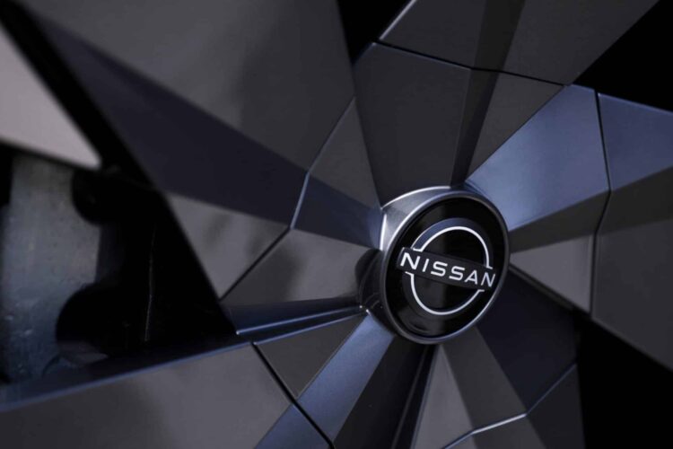 A Nissan Motor Co. badge on the wheel hub of an Ariya electric crossover sport utility vehicle (SUV) during a test driving event in Tokyo, Japan, on Monday, April 17, 2023. Renault SA is set to cut its holding in Nissan to 15% from 43%, while Nissan intends to take a stake of as much as 15% in Renaults EV business, Ampere.