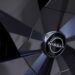 A Nissan Motor Co. badge on the wheel hub of an Ariya electric crossover sport utility vehicle (SUV) during a test driving event in Tokyo, Japan, on Monday, April 17, 2023. Renault SA is set to cut its holding in Nissan to 15% from 43%, while Nissan intends to take a stake of as much as 15% in Renaults EV business, Ampere.