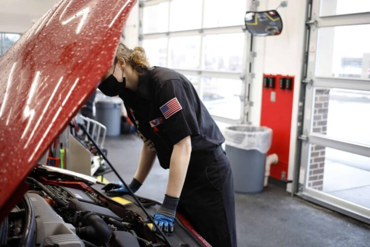 An employee works under the hood of a vehicle at a Valvoline Inc. Instant Oil Change location in Indianapolis, Indiana, U.S., on Wednesday, Feb. 2, 2022. Valvoline Inc. is expected to release earnings figures on February 8.