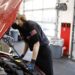 An employee works under the hood of a vehicle at a Valvoline Inc. Instant Oil Change location in Indianapolis, Indiana, U.S., on Wednesday, Feb. 2, 2022. Valvoline Inc. is expected to release earnings figures on February 8.