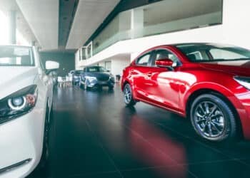 New Cars Parked In Luxury Showroom