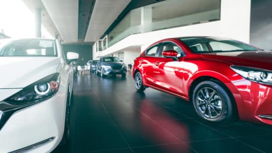 New Cars Parked In Luxury Showroom