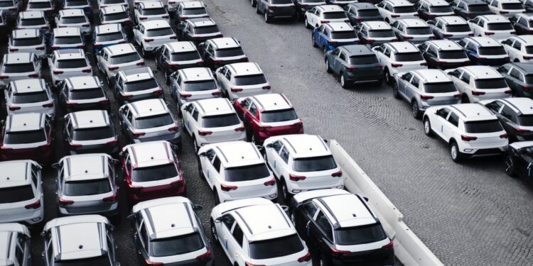 A parking lot with many new cars