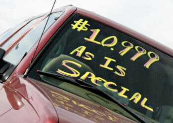 Used car with $10,000 as is special written on windshield