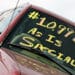 Used car with $10,000 as is special written on windshield