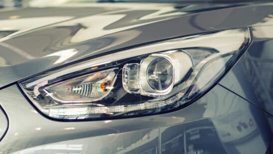 Close up of silver car headlight