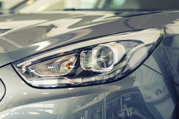Close up of silver car headlight