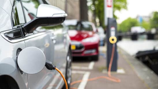 Silver electric vehicle at a charging station