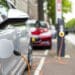 Silver electric vehicle at a charging station