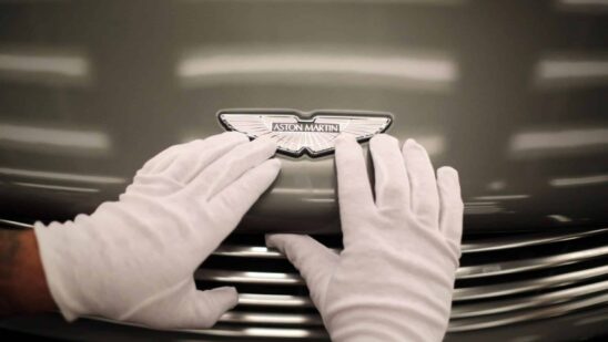 GAYDON, ENGLAND - JANUARY 10: An Aston Martin Vanquish is inspected by hand inside a light booth at the company headquarters and production plant on January 10, 2013 in Gaydon, England. The iconic British brand is celebrating its 100th anniversary. Lionel Martin and Robert Bamford created Bamford & Martin on January 15 1913, which later became Aston Martin in honour of Bamfords wins at the Aston Clinton Hillclimb in Buckinghamshire.
