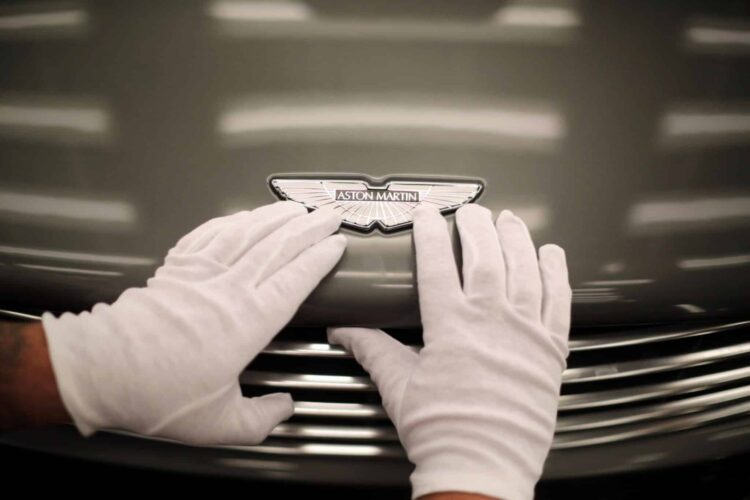 GAYDON, ENGLAND - JANUARY 10: An Aston Martin Vanquish is inspected by hand inside a light booth at the company headquarters and production plant on January 10, 2013 in Gaydon, England. The iconic British brand is celebrating its 100th anniversary. Lionel Martin and Robert Bamford created Bamford & Martin on January 15 1913, which later became Aston Martin in honour of Bamfords wins at the Aston Clinton Hillclimb in Buckinghamshire.