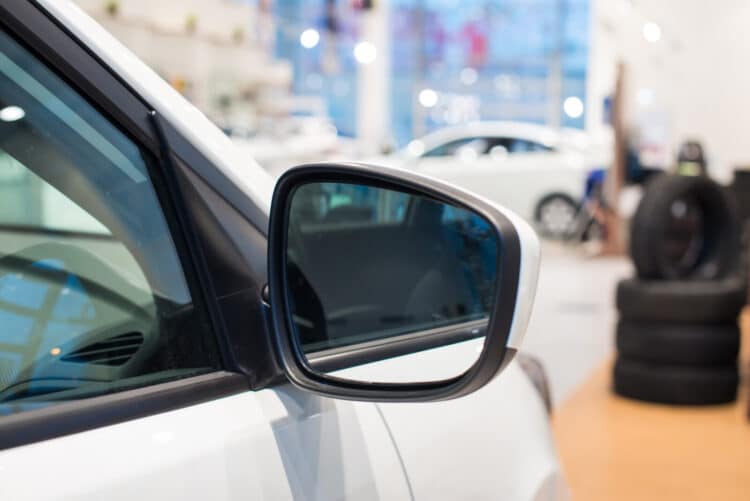 Car side mirror in a dealership