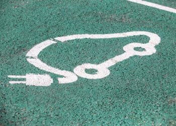 Electric vehicle charging sign on asphalt