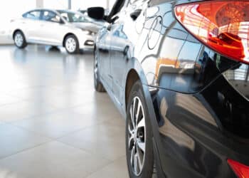 Close up of back of car in dealership showroom