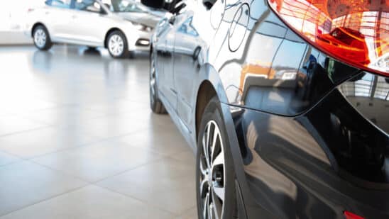 Close up of back of car in dealership showroom