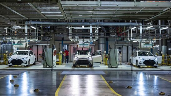 Automobiles in the quality control inspection area at the Toyota Motor Manufacturing plant