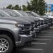 A customer looks over General Motors Co. Chevrolet vehicles displayed for sale at a car dealership in Grove City, Ohio, U.S., on Saturday, Aug. 15, 2020. Sport-utility vehicles and trucks are dominating U.S. auto sales like never before as carmakers start to recover from the biggest shock to their industry in decades.