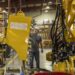 Kyle Kersbergen works on heavy machinery at Weiler, a manufacturing factory, in Knoxville, Iowa, US, on Thursday, July 21, 2023.