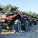 Parked atv and utv on a mountain road.