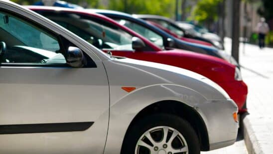 Cars lined up in parking spots