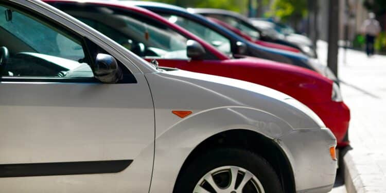 Cars lined up in parking spots