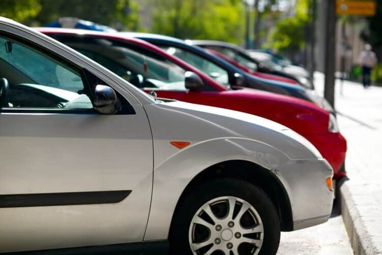 Cars lined up in parking spots