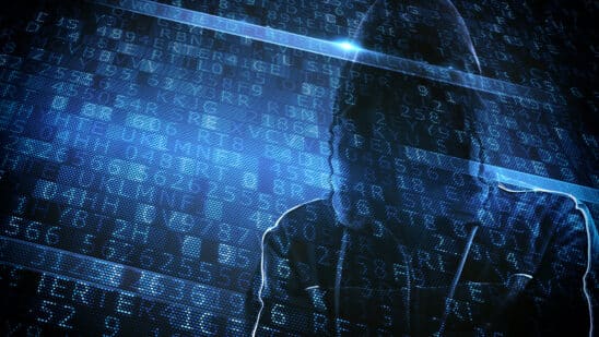 Hidden identity of a hacker with a man with hoodie