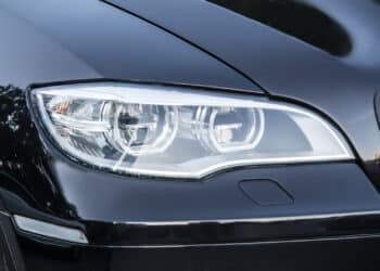 Close up of black car headlight