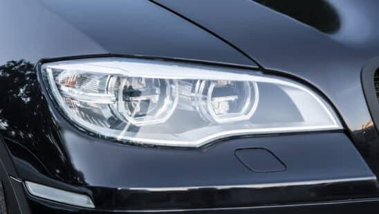 Close up of black car headlight