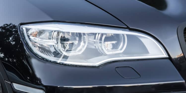 Close up of black car headlight