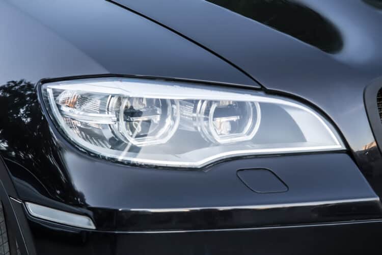 Close up of black car headlight